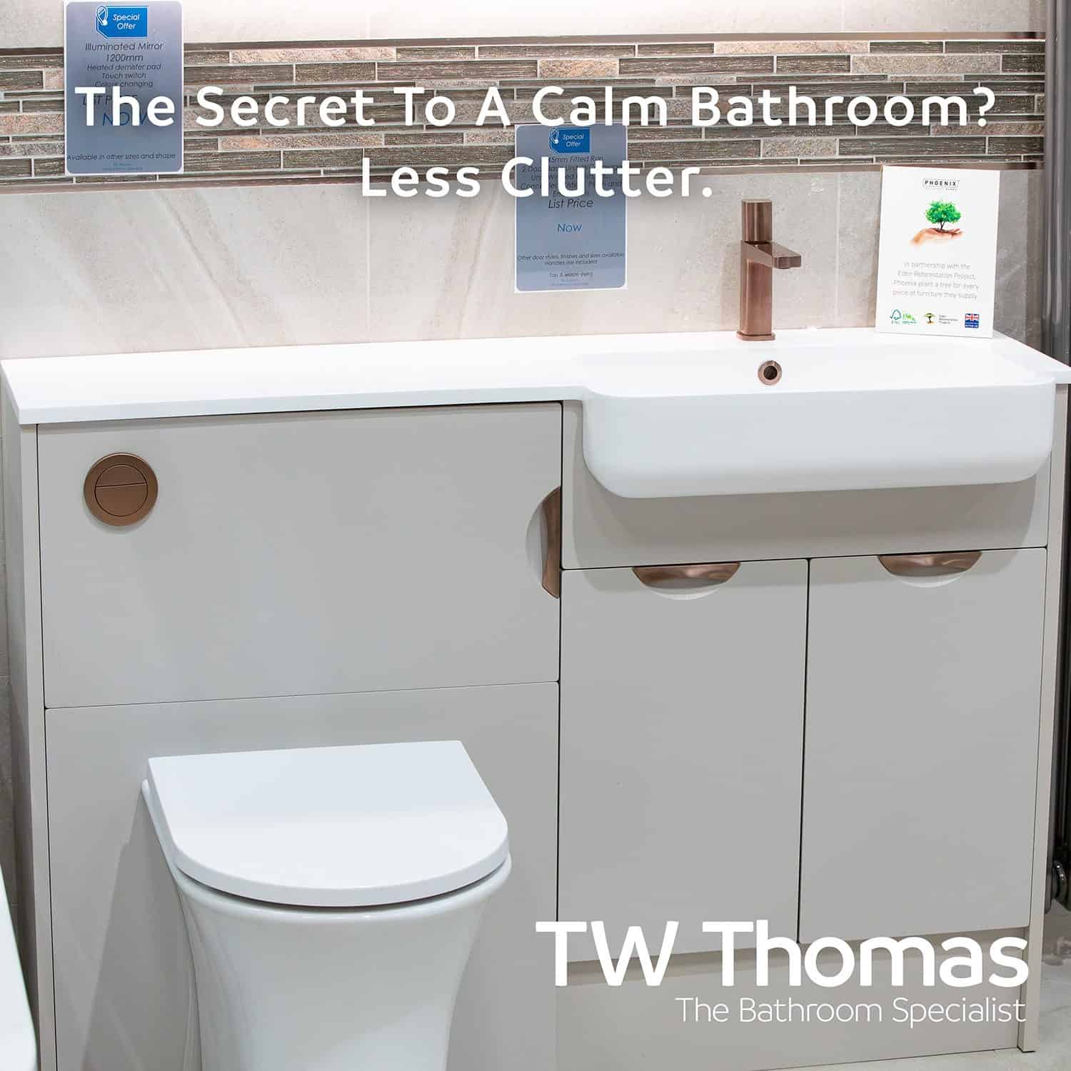 A white fitted WC unit and basin run with brushed copper handles and tap against stone-effect tiles, captioned The Secret To A Calm Bathroom? Less Clutter