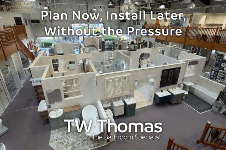 The TW Thomas showroom seen from the mezzanine with room-set displays laid out below, captioned Plan Now, Install Later, Without the Pressure