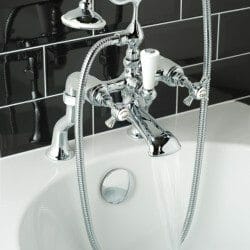 close up classical bathroom bath mixer tap and shower head