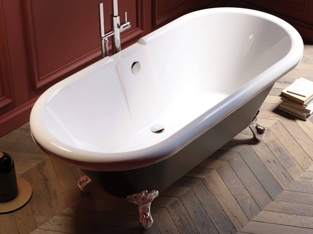 Adamsez roll-top bath on claw feet against deep red panelling with a herringbone timber floor