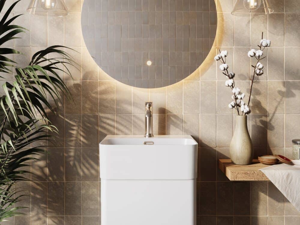 Armera Reef 380mm cloakroom unit with a Vaere mixer below a round backlit mirror