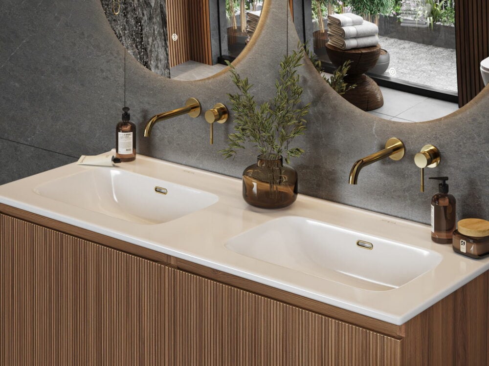 Armera Palladium walnut wall-hung vanity with a 1200mm double cabinet basin, brushed gold wall-mounted mixers and round mirrors above a stone splashback