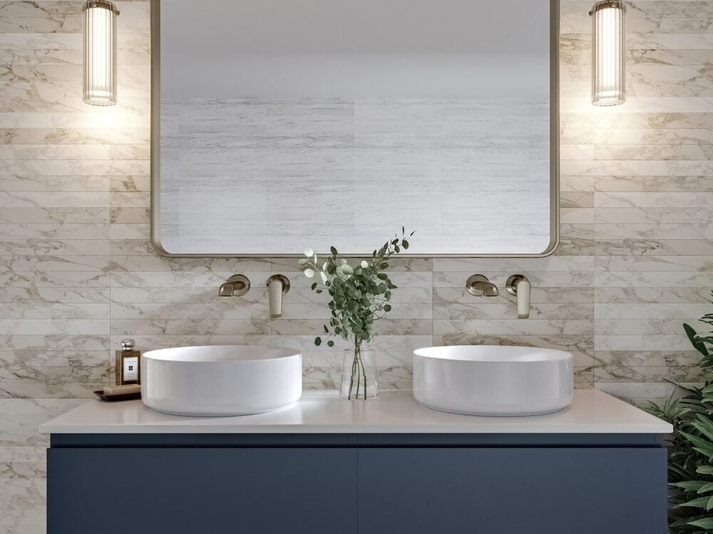 Armera Opa blue double vanity with two round countertop basins, wall-mounted brass taps and pendant lights