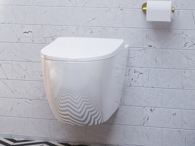 Armera Maya rimless wall-hung WC with a Modus flush plate and brushed gold toilet roll holder