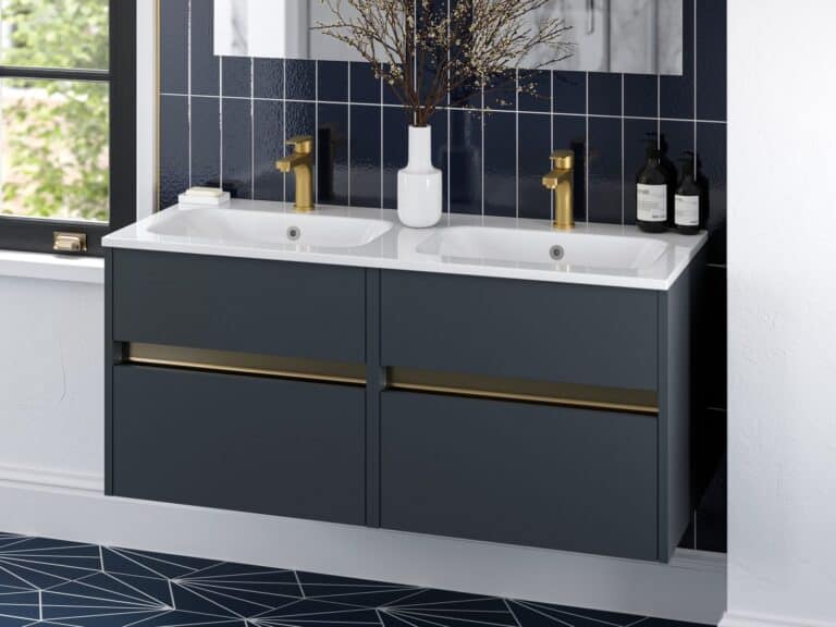 Dark blue double vanity unit with brass handles and twin basins