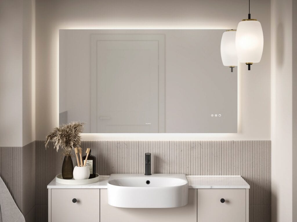 Pendant lights and a backlit LED mirror above a vanity basin