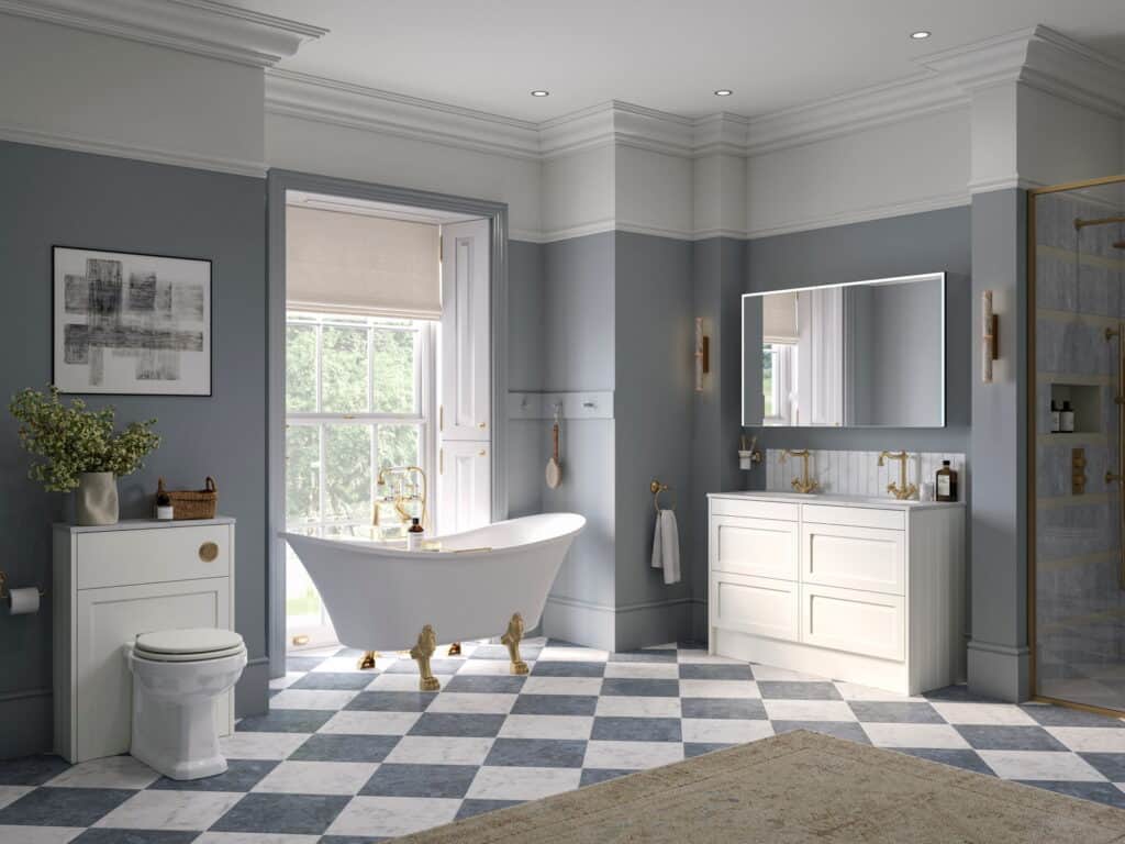 Calypso Kentmere furniture in cotton white with a roll-top bath on gold feet and a chequerboard floor in a blue-grey bathroom