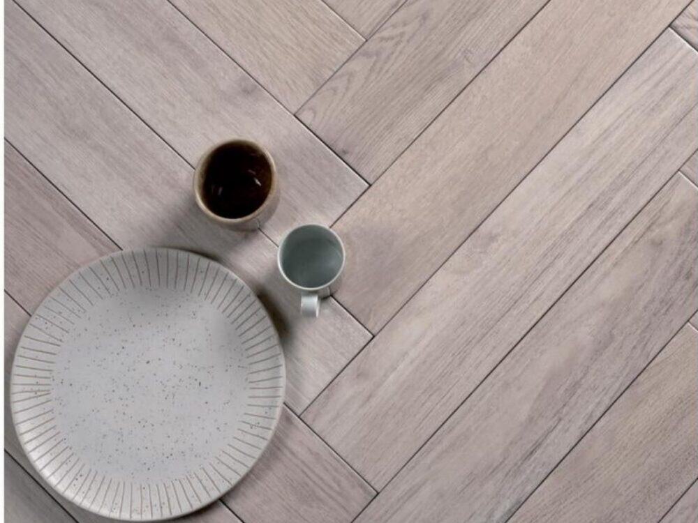 A pale herringbone wood effect porcelain floor