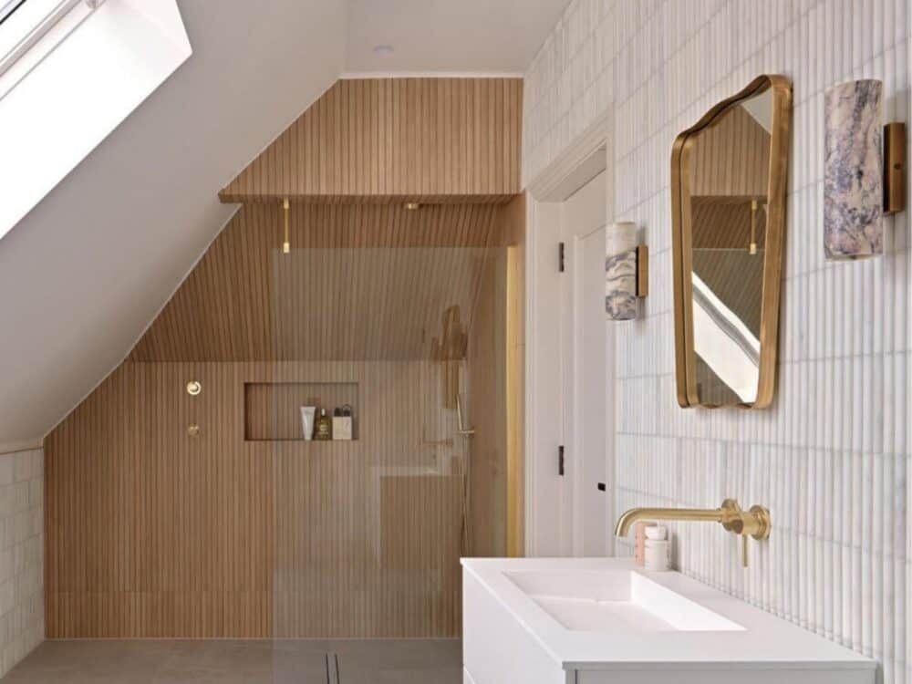 A timber effect tiled shower beside a white basin unit