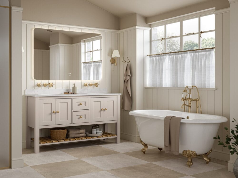 Calypso Charlbury freestanding vanity with twin basins and a roll-top bath on gold feet in a panelled bathroom
