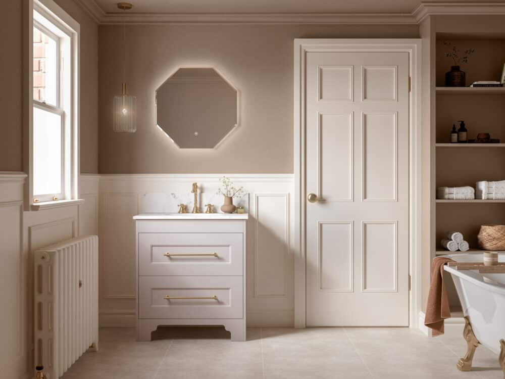 Calypso Chelworth freestanding vanity in cashmere with an octagonal backlit mirror and alcove shelving