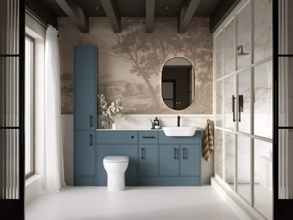 Calypso Dartmoor fitted furniture in dark sapphire with a tall unit and back-to-wall WC against a scenic mural and Crittall screens