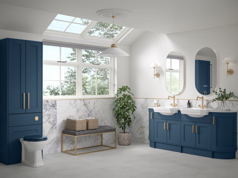 Calypso Pentland fitted furniture in maritime blue with twin basins, oval mirrors and a tall unit below a skylight