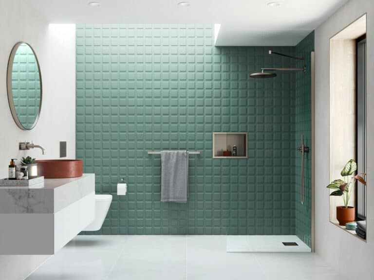 Flair AYO wetroom panel with an angled stabilising bar in brushed nickel, against green tiles