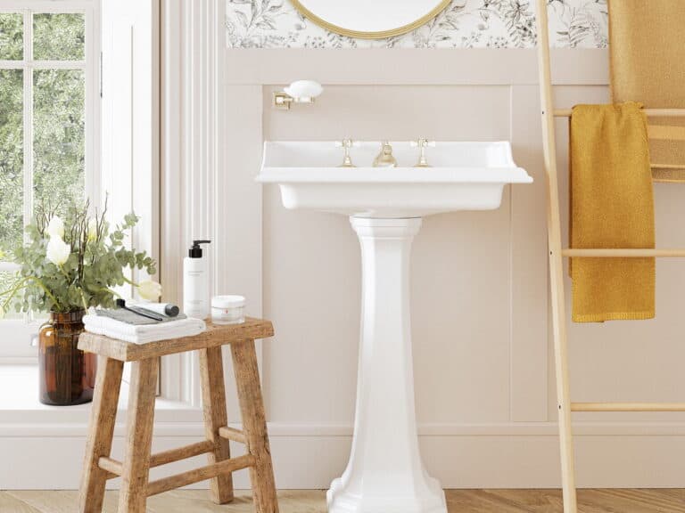 Heritage pedestal basin with traditional brassware, towel rail and accessories