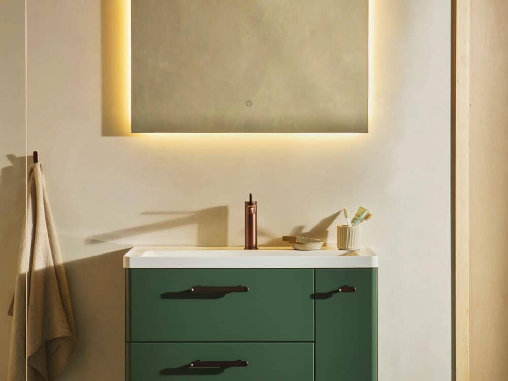 HiB Sierra floor-standing unit in green with a backlit mirror and brushed brass fittings