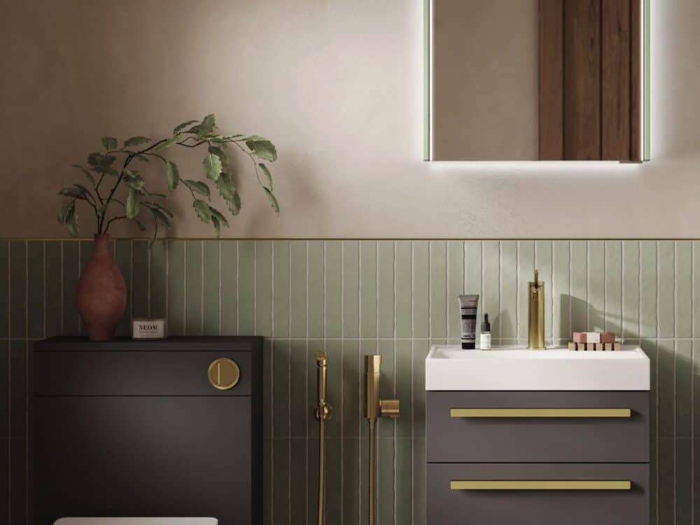 HiB Tranquil furniture run in grey with brushed brass handles and a wall-hung WC