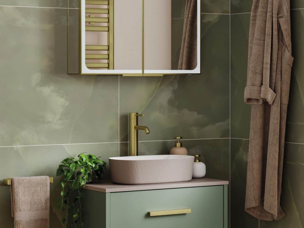 HiB Veles wall-hung unit in green with a countertop basin and brushed brass towel rail