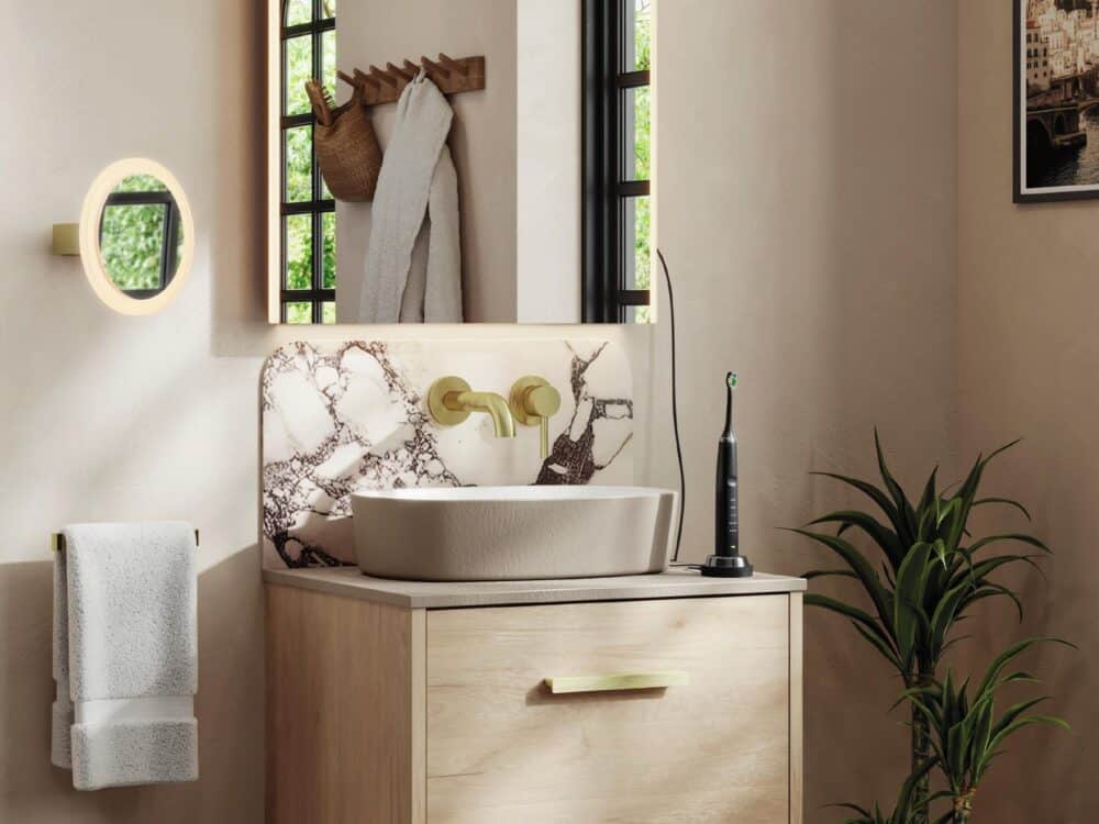 HiB Terra vessel basin on an oak unit below an arched mirror