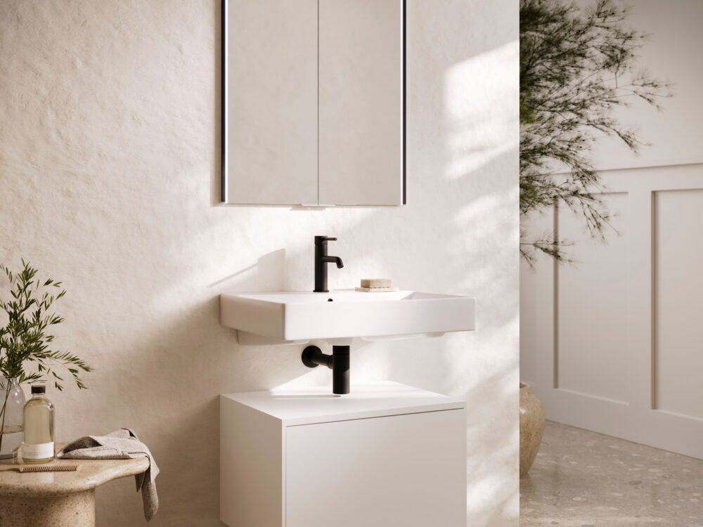 HiB Odelle recessed mirror cabinet above a wall-hung basin with a black mixer