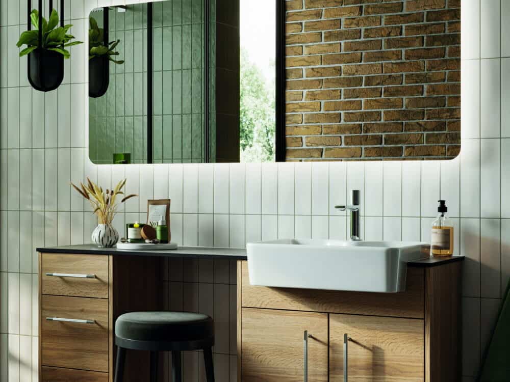 HiB Ambience illuminated mirror above a wall-hung basin in a brick and tile bathroom