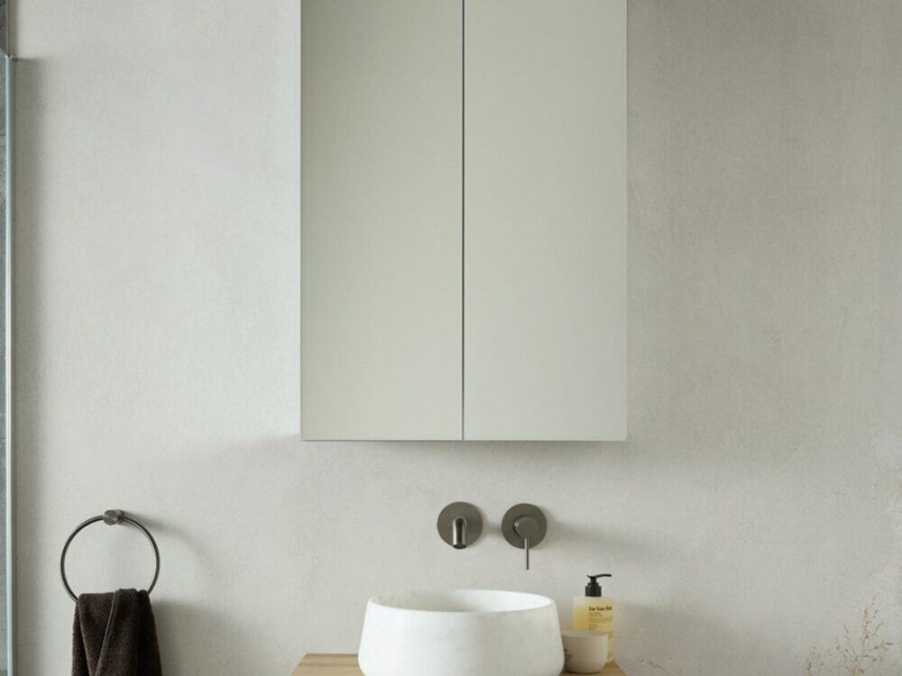 hib.inspire Lucent 60 LED mirror cabinet above a Nuvia Milas White Marble basin on an oak shelf