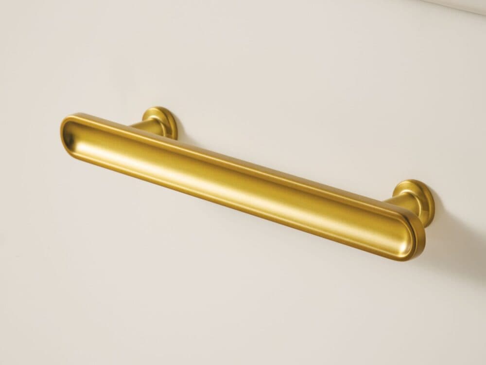 hib.inspire Ferra furniture handle in brushed brass on a matt white drawer front
