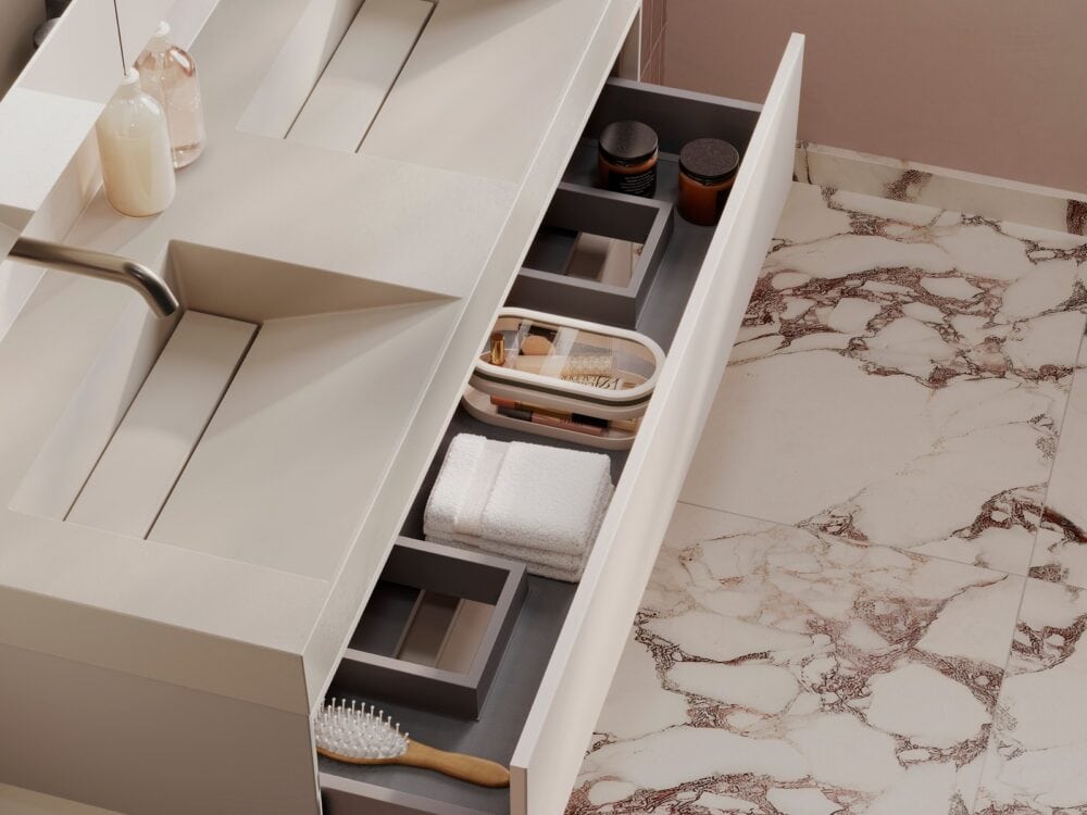 Open drawer of a hib.inspire Pennine 120 basin unit in Light Taupe showing the fitted internal organisers