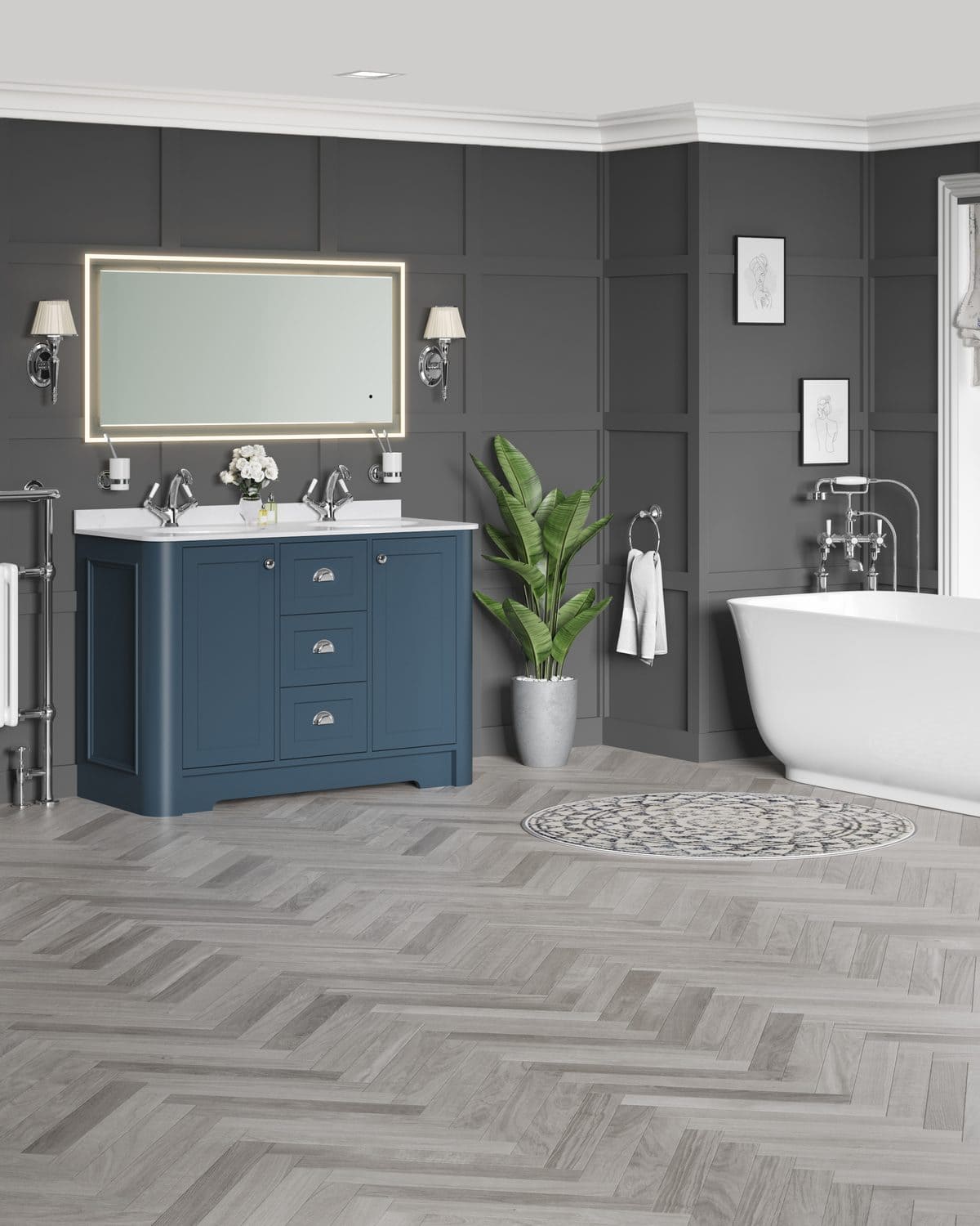 Bathroom with a navy double vanity unit, illuminated mirror and freestanding bath