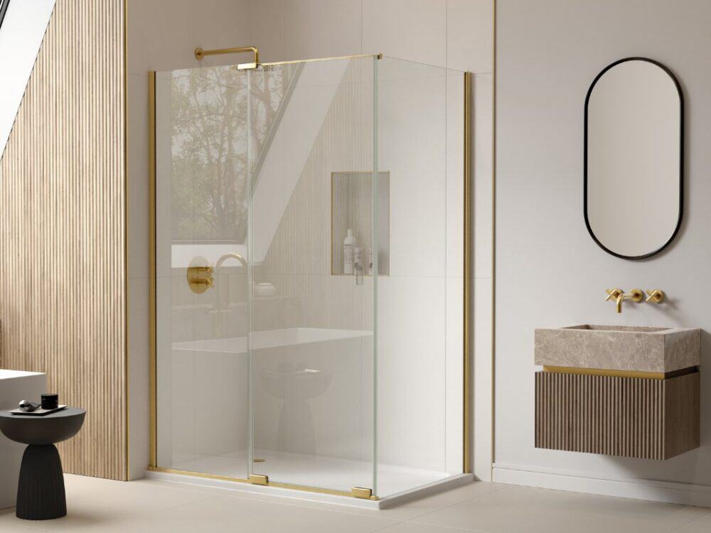 Merlyn Arysto X shower enclosure with gold frame and a fluted wall panel