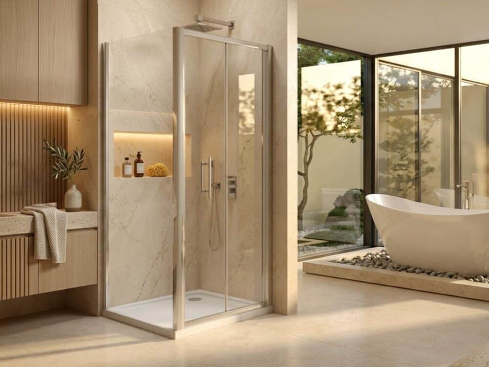 Merlyn 6 Series bifold shower door in a stone bathroom opening to a garden