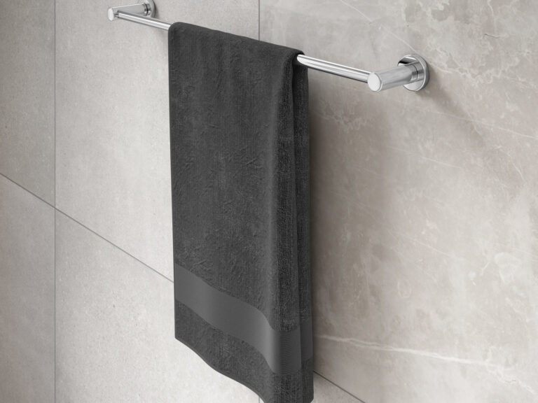 MyLife Avon chrome single towel rail with a folded towel on stone-effect tiles
