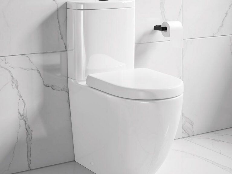 MyLife Edison fully enclosed close-coupled toilet against white marble-effect tiles