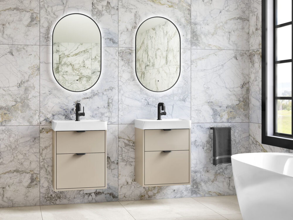 MyLife Calia fine greige twin wall-hung vanities with oval mirrors in a marble bathroom