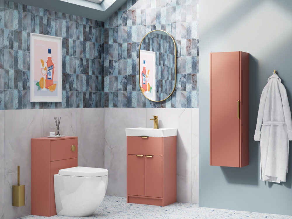 MyLife Calia soft terracotta floor-standing vanity, WC unit and tall cabinet against blue tiling