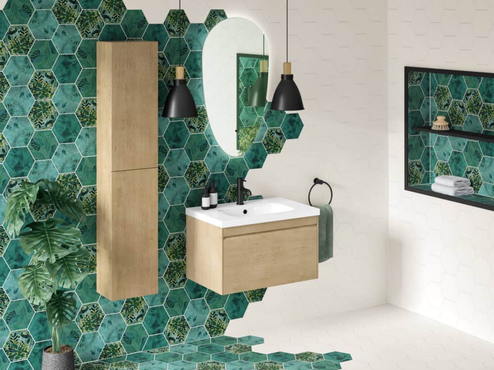 MyLife Hampton oak wall-hung vanity and tall unit against emerald hexagon tiles with an oval mirror