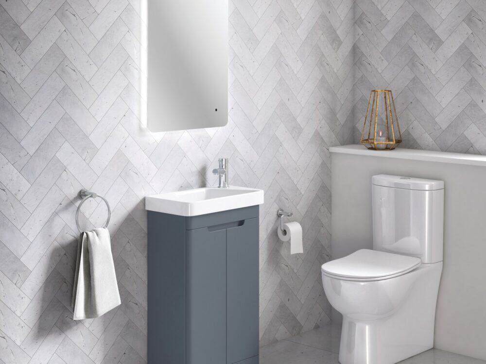 MyLife Atmore 500 blue cloakroom vanity and close-coupled toilet with herringbone wall tiles