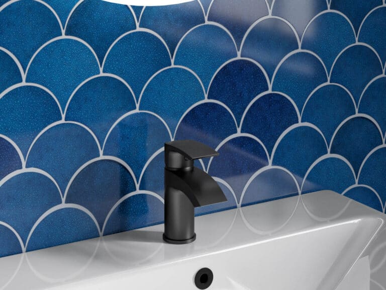 MyLife Versa matt black mono basin mixer on a white basin against blue fish-scale tiles