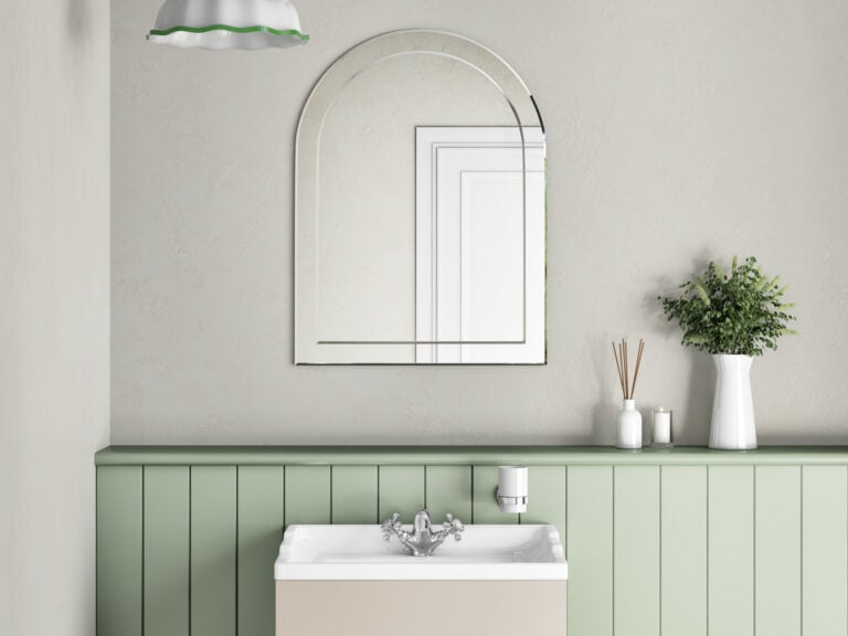 MyLife arched non-illuminated bathroom mirror above a basin unit with sage green panelling