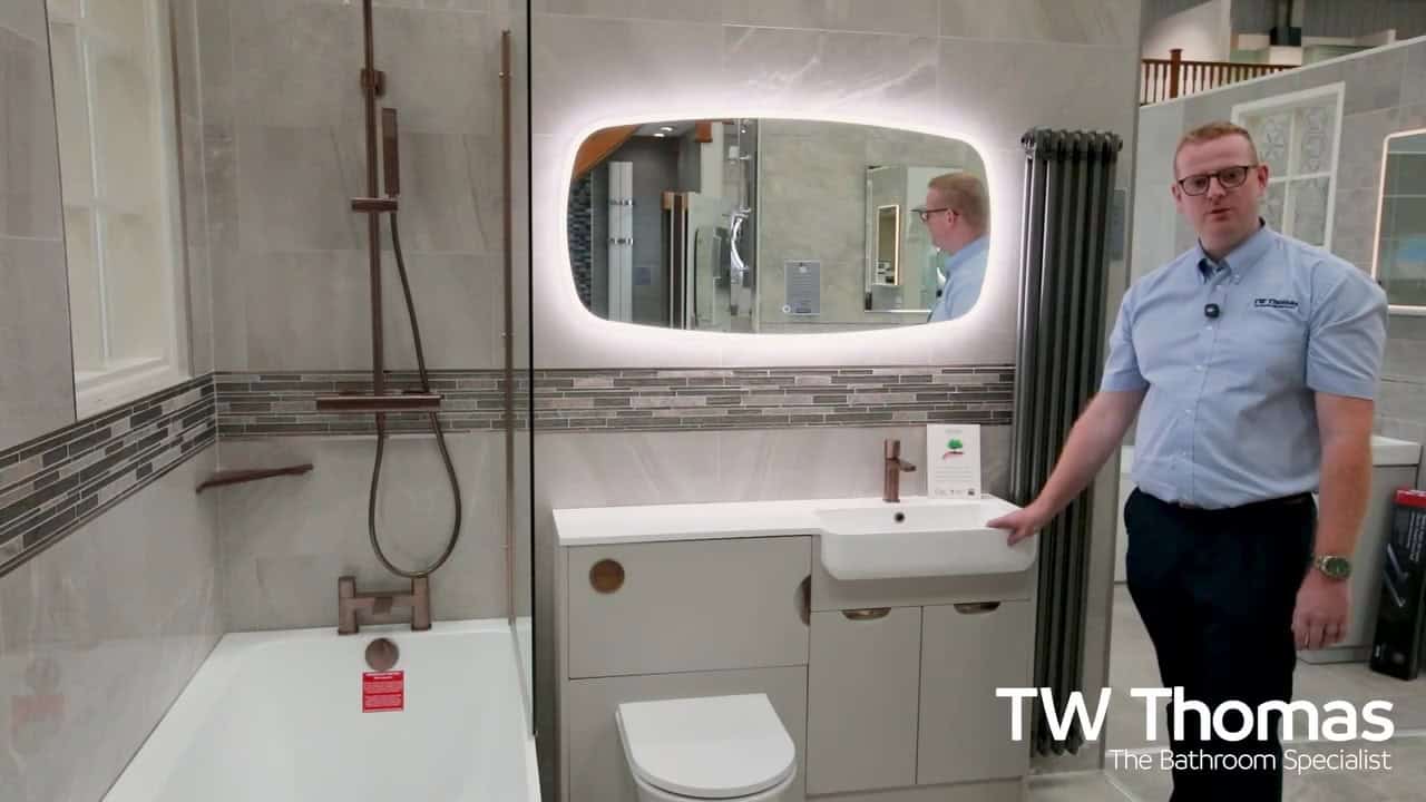A still from the TW Thomas video Berian on storage, brushed bronze and a one-piece basin