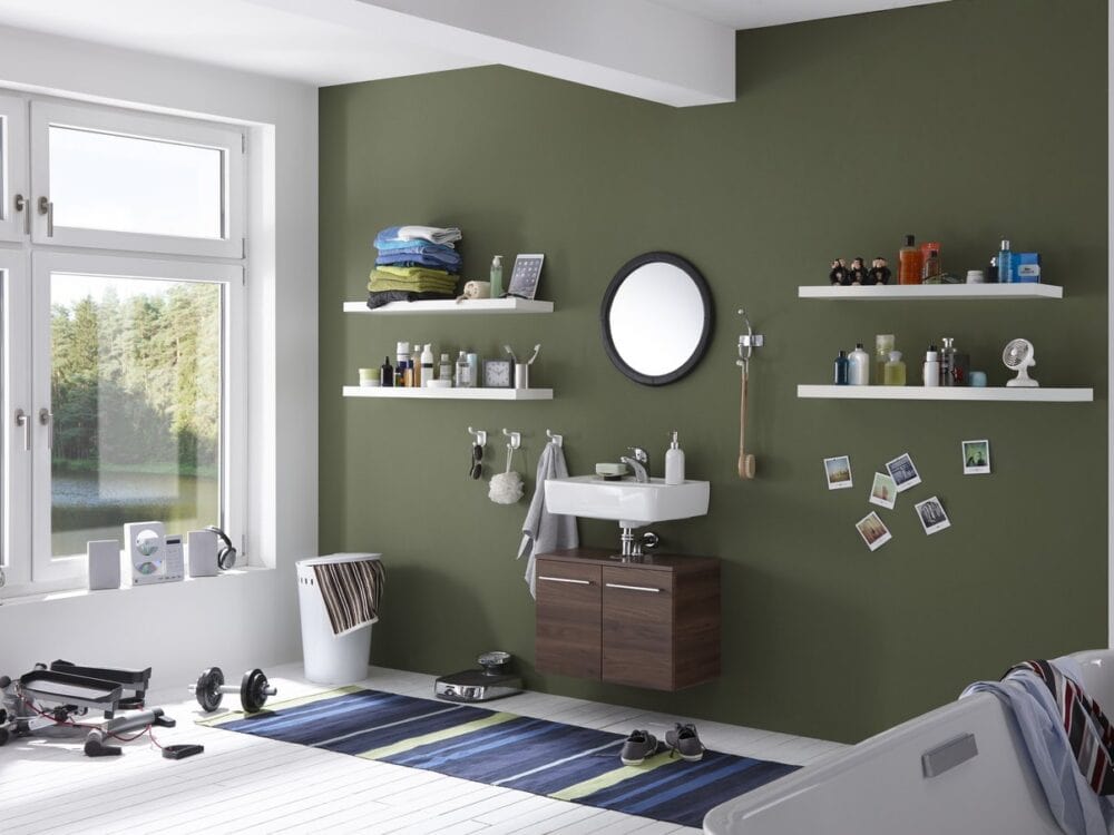 Pelipal PCON washbasin and shelving against a green wall