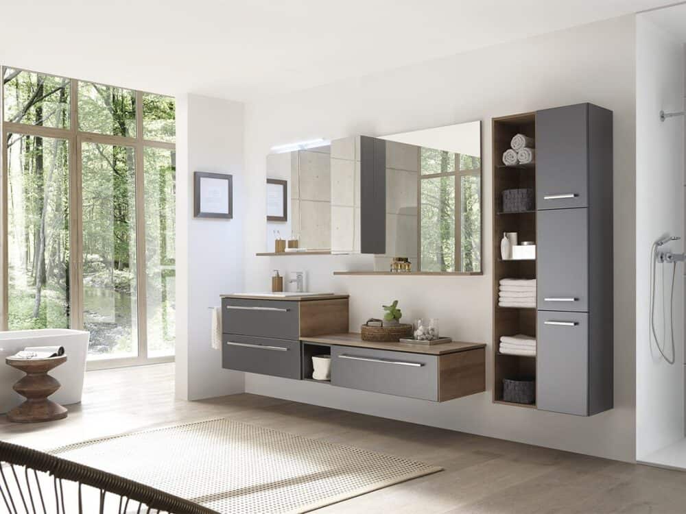 Pelipal PCON grey vanity unit and tall cabinets in a bathroom with a woodland view