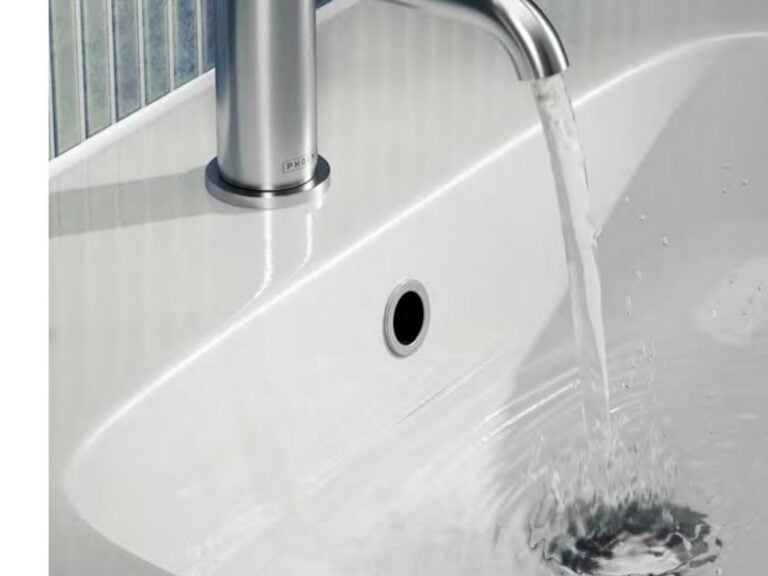 Phoenix Piolo chrome basin mixer running into a white countertop basin