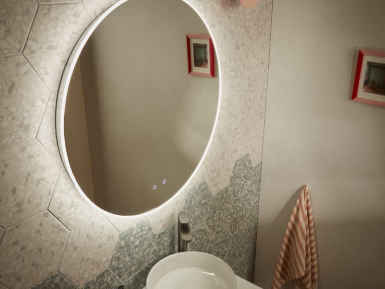 A large round R2 Levitate illuminated mirror lit against a terrazzo wall above a basin