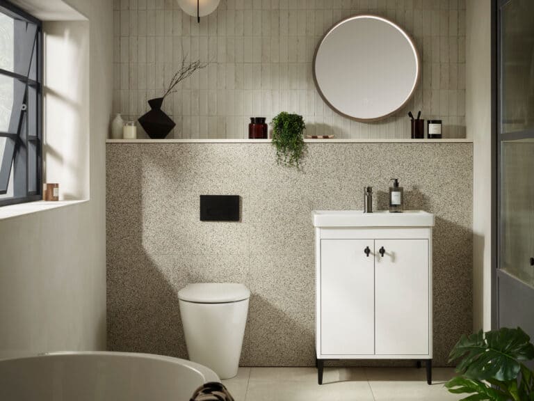 An R2 Paragon 600mm freestanding vanity unit in white on slim legs, with a round mirror and a back-to-wall WC