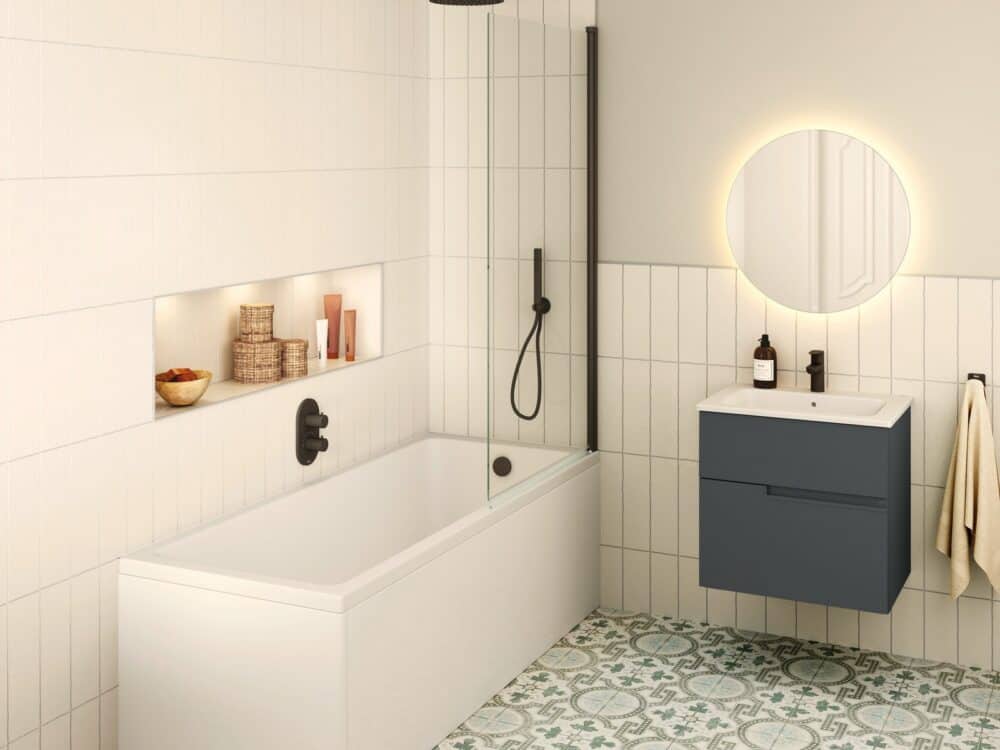 Roca The Gap single-ended bath with a teal wall-hung vanity and illuminated round mirror