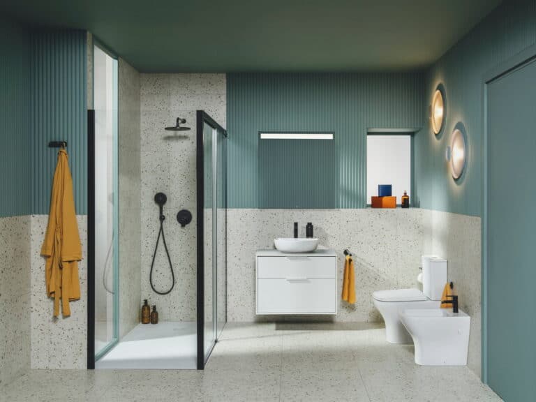 Roca Optica bathroom with a walk-in shower, wall-hung vanity, close-coupled WC and illuminated mirror against terrazzo and sage green