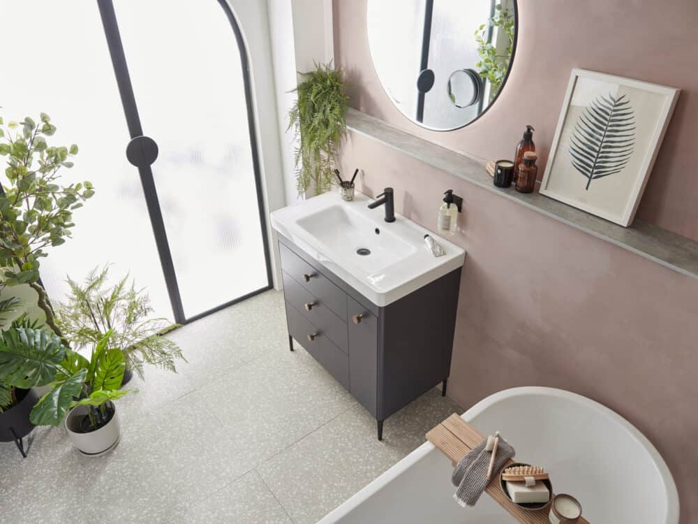 Roper Rhodes Fairmont vanity unit in matt carbon with a freestanding bath against pink walls