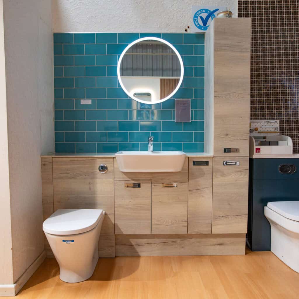 A teal tiled display with an oak fitted furniture run and a WC