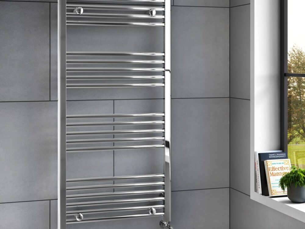 MyLife Alma 1200 x 600 straight chrome heated towel rail in a bathroom setting